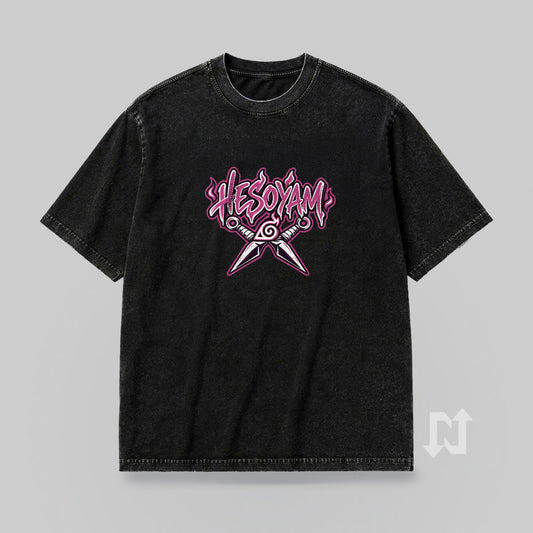 Front mockup of the dark SHIKAMARU HESOYAM T-shirt, with a small pink chest graphic.